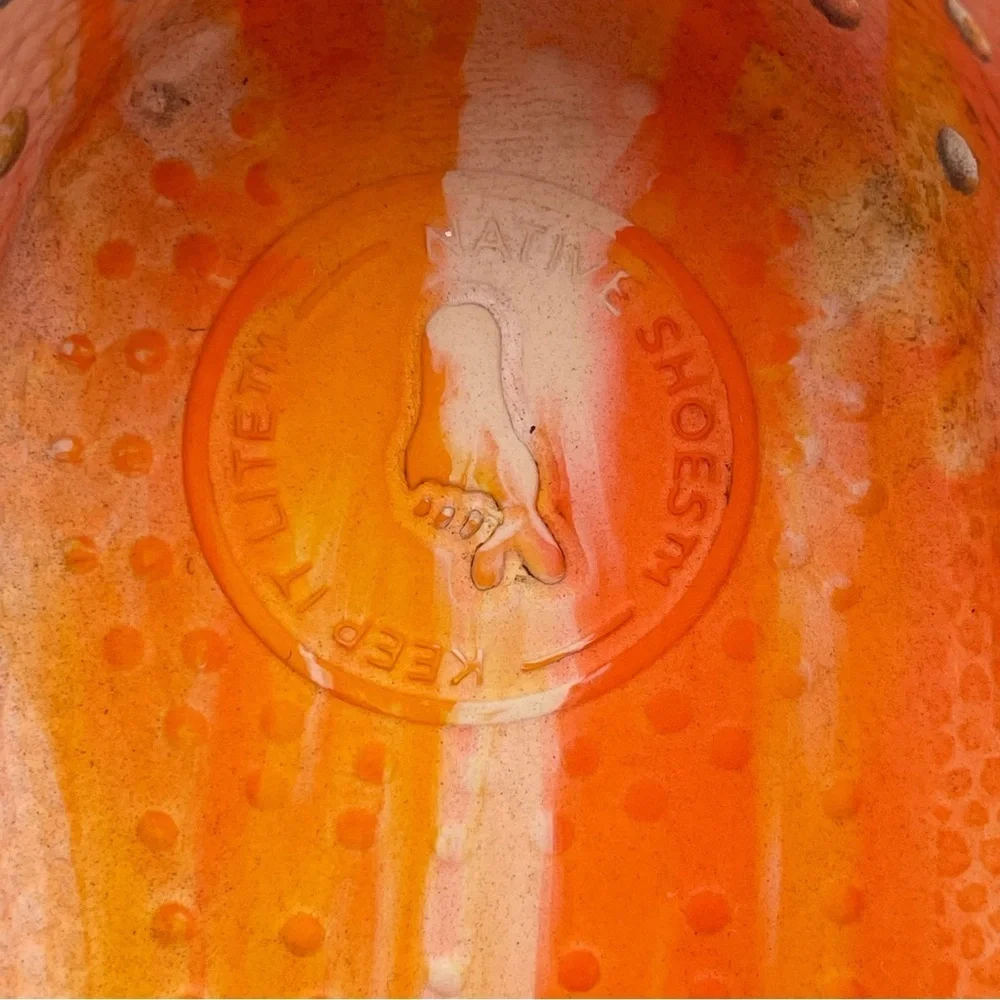 Native orange swirl slip on size 2 water shoes